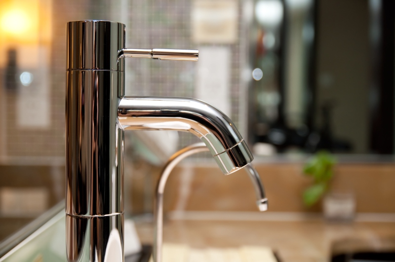 Leaking tap being repaired in Finchley Central